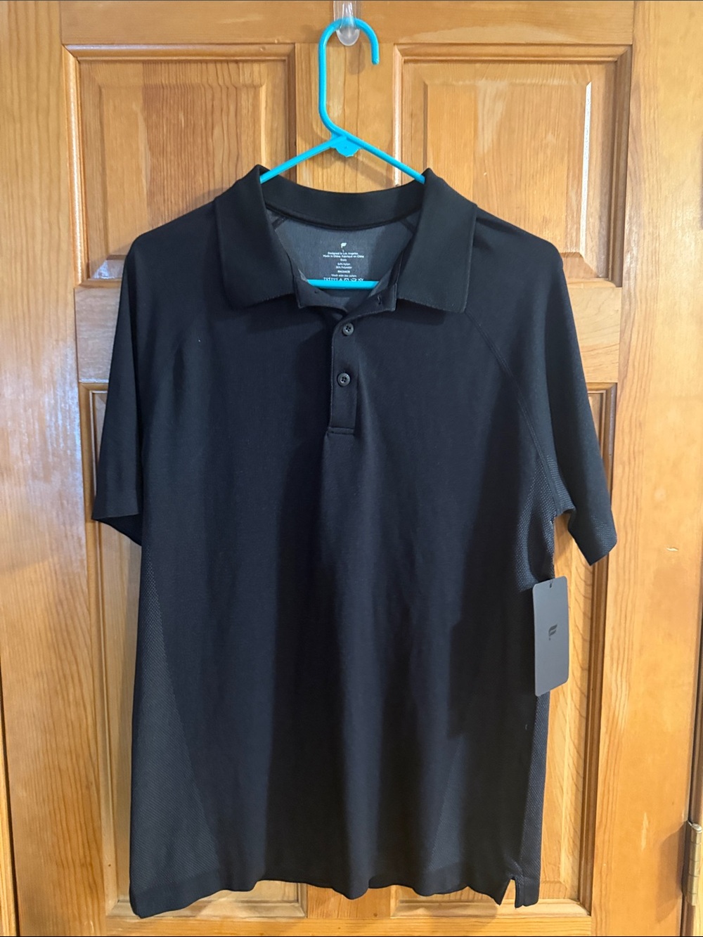 Fabletics black the training day polo size large .